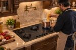 اجاق گاز صفحه‌ای پنج شعله در آشپزخانه